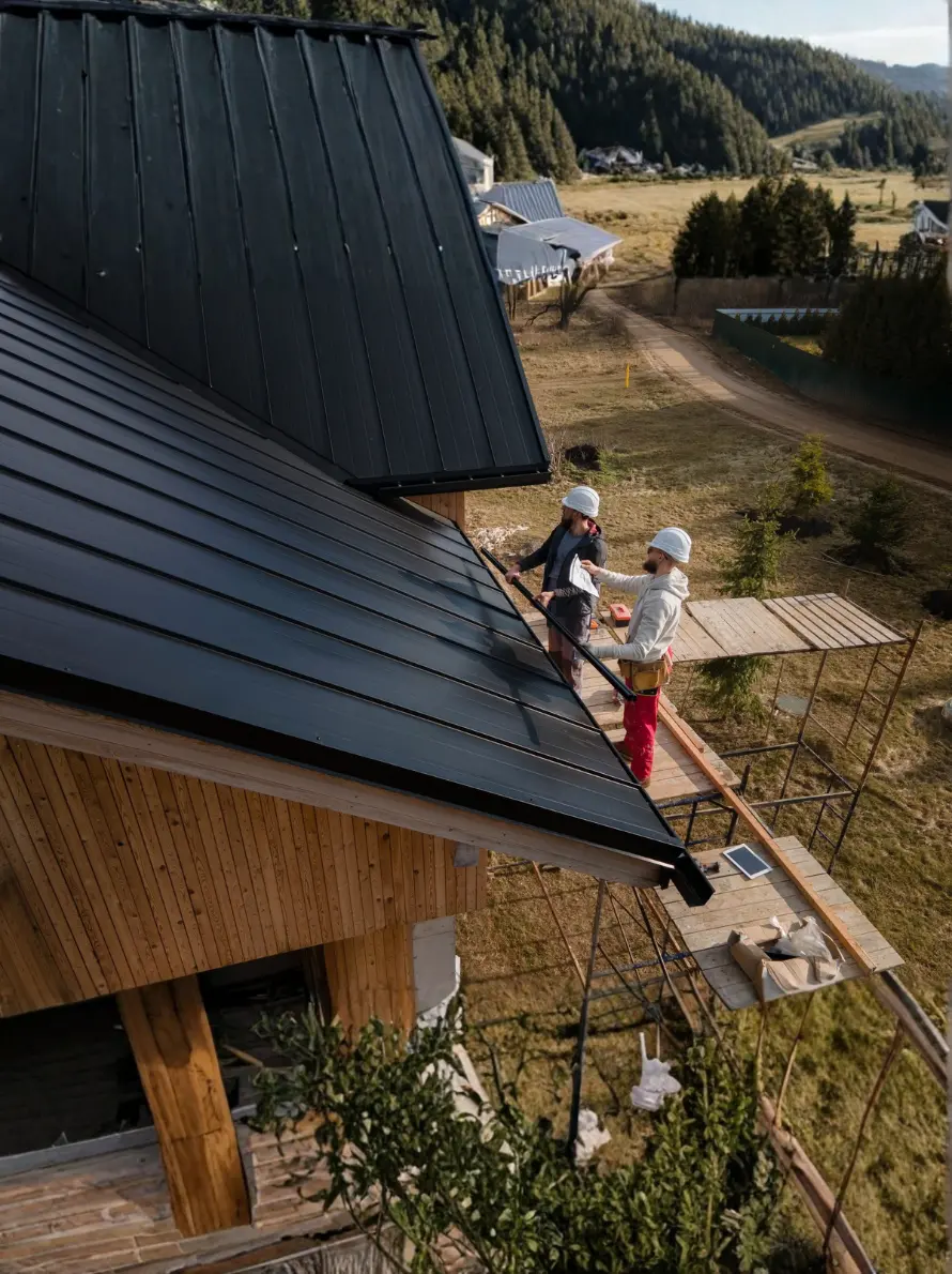 Men working on the siding of a House - 6